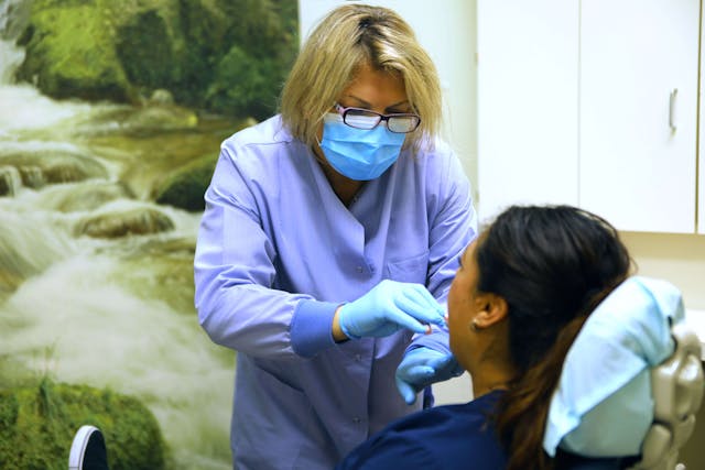 Dr. Ellen performing treatment for a patient